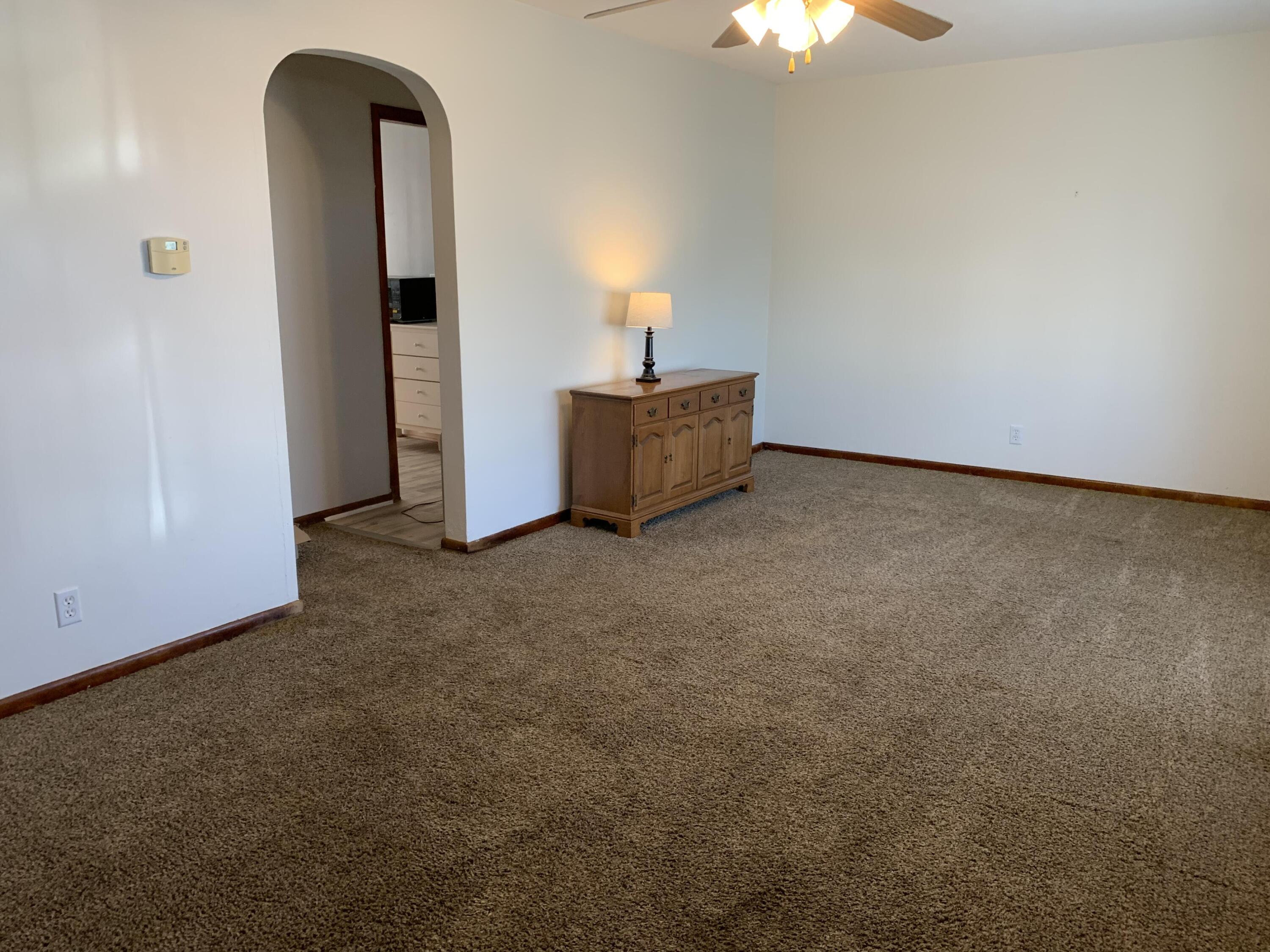 111 West Rutsen Street Rensselaer, IN 47978 - Photo 2 of 21 wooden floor in an empty room with a window