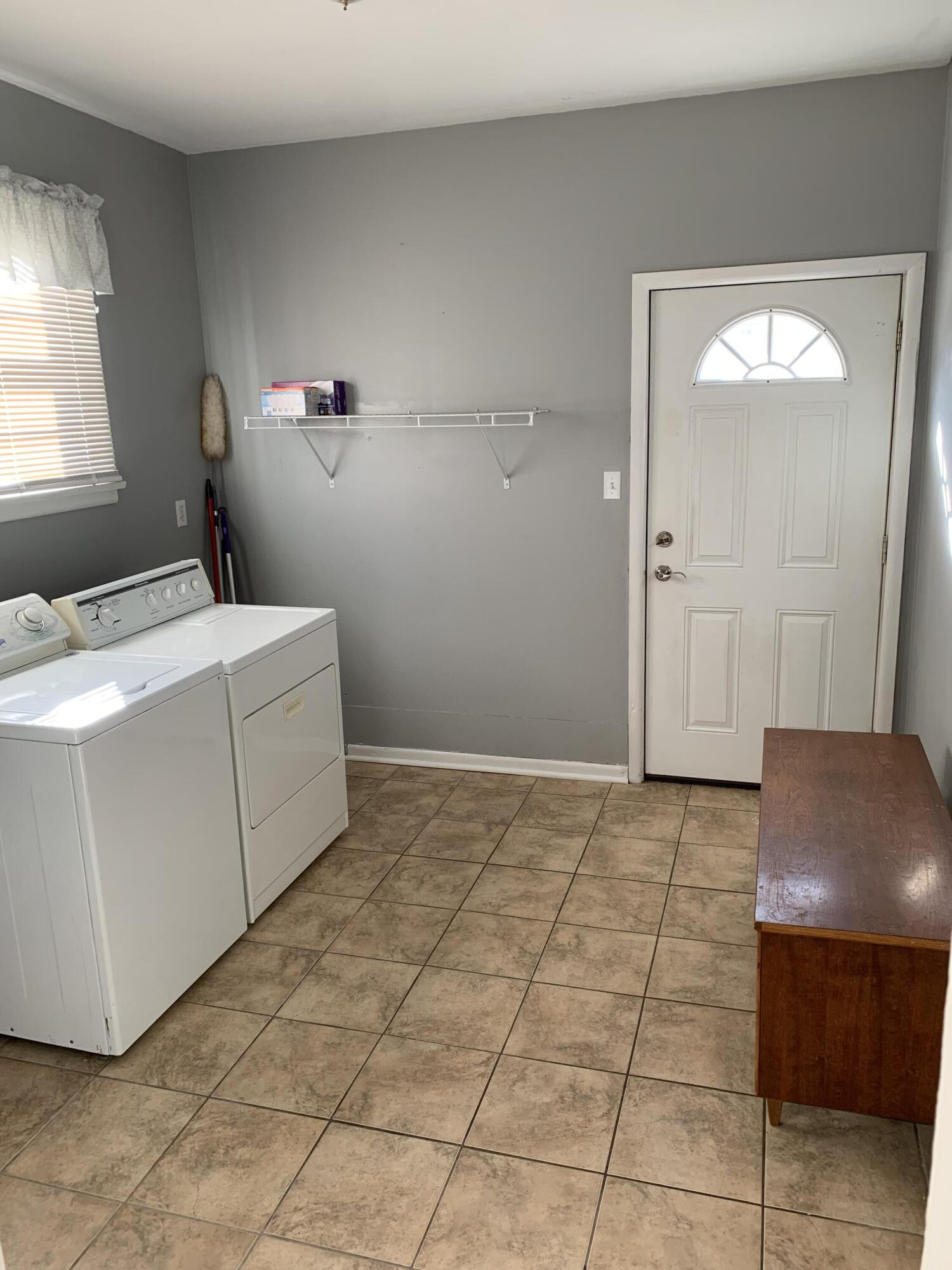 111 West Rutsen Street Rensselaer, IN 47978 - Photo 9 of 21 a bedroom with a bed and a chair