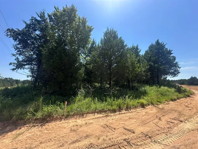 a wooden bench with a lake view
