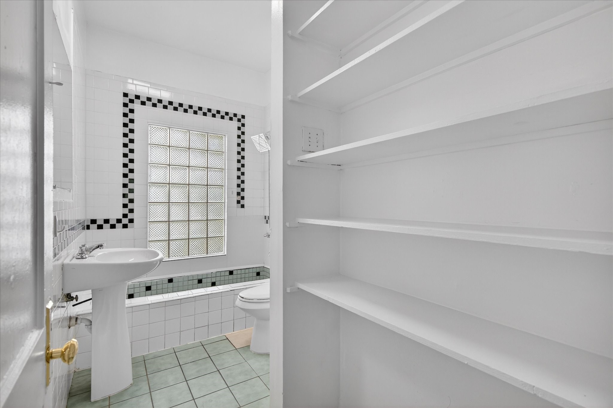 1607 Holman Street Houston, TX 77004 - Photo 23 of 24 a bathroom with a bathtub and a shower