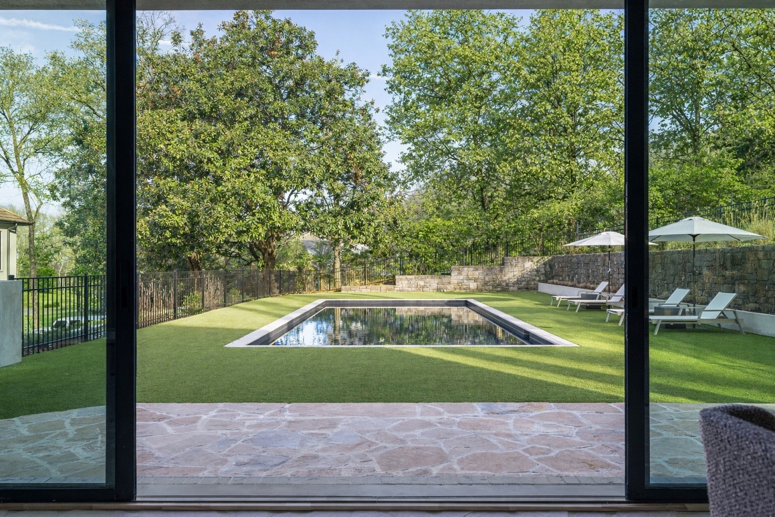 1049 Overton Lea Road Nashville, TN 37220 - Photo 3 of 53 a view of a swimming pool with a yard