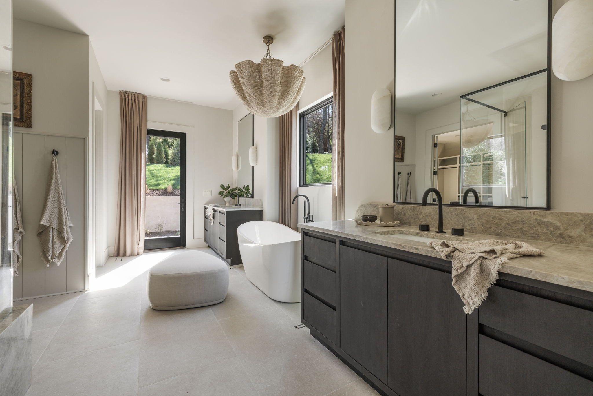 1049 Overton Lea Road Nashville, TN 37220 - Photo 31 of 53 a spacious bathroom with a double vanity sink a mirror and a bathtub