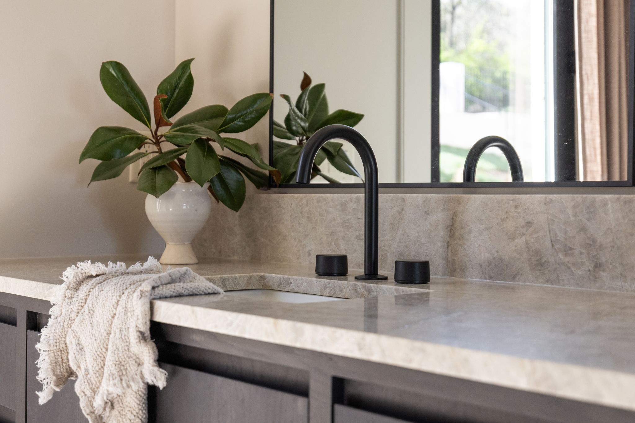 1049 Overton Lea Road Nashville, TN 37220 - Photo 32 of 53 a close view of a sink a faucet a potted plant and a wooden floor