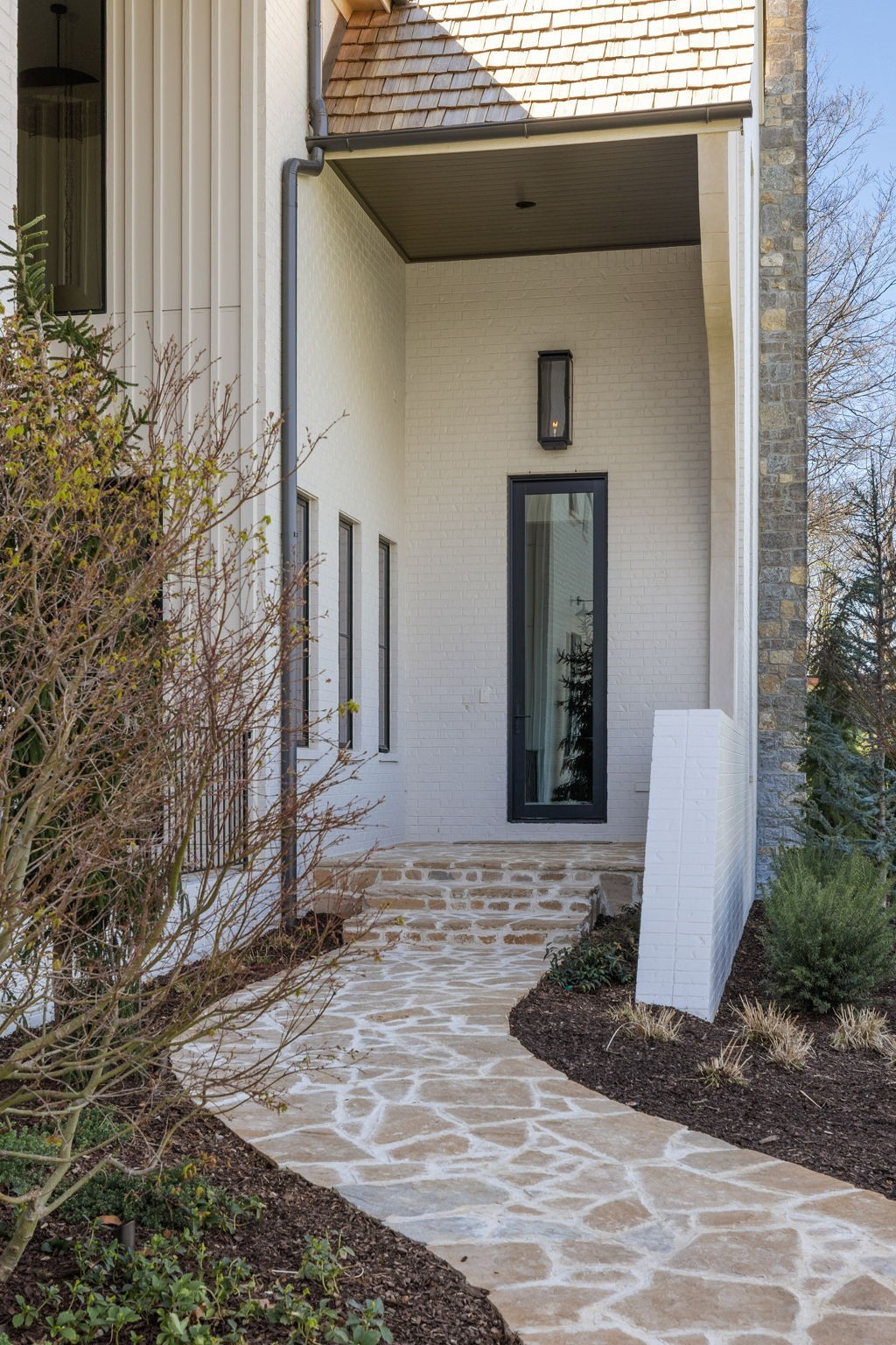 1049 Overton Lea Road Nashville, TN 37220 - Photo 4 of 53 a front view of a house with garden