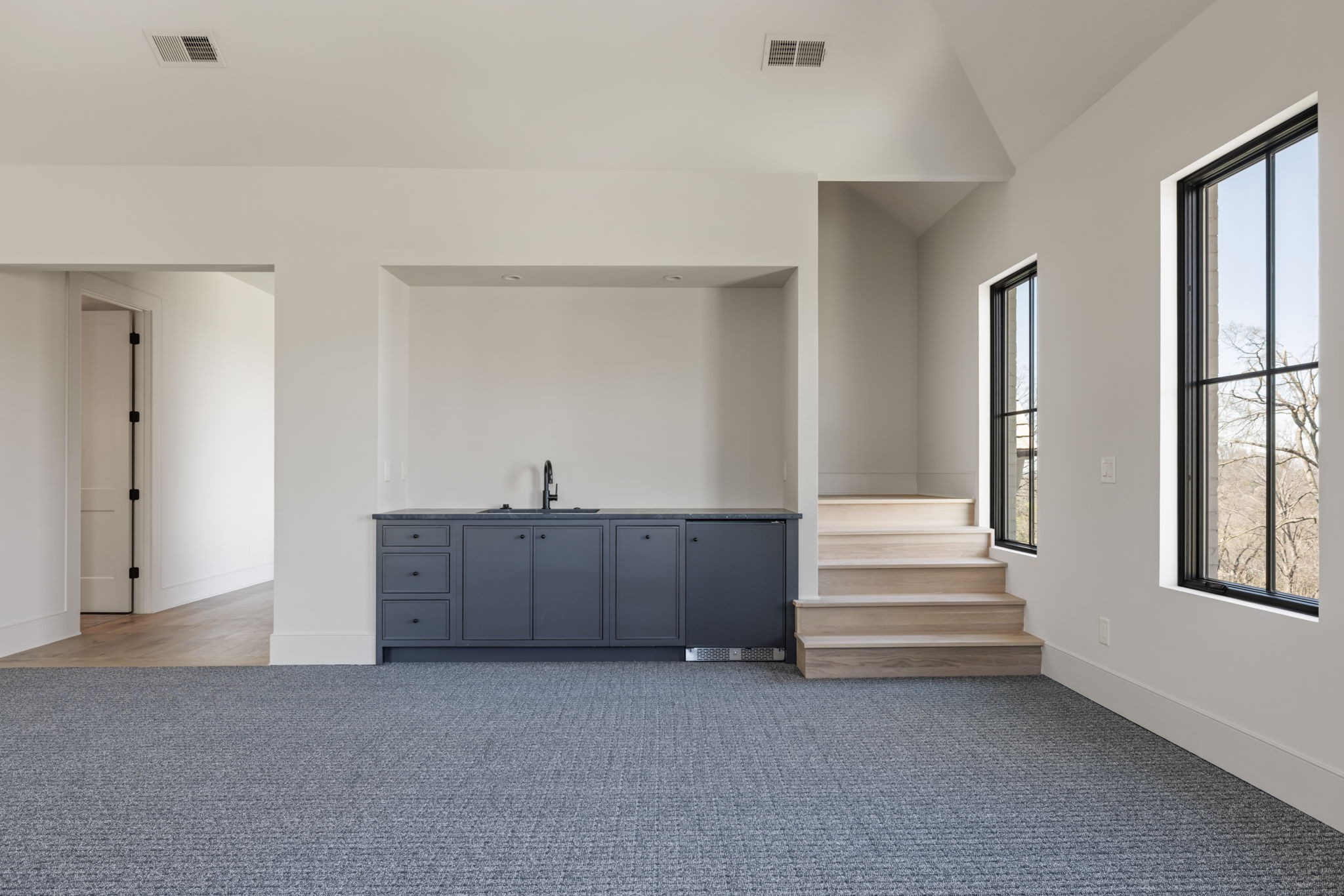 1049 Overton Lea Road Nashville, TN 37220 - Photo 42 of 53 a view of an empty room with stairs and windows