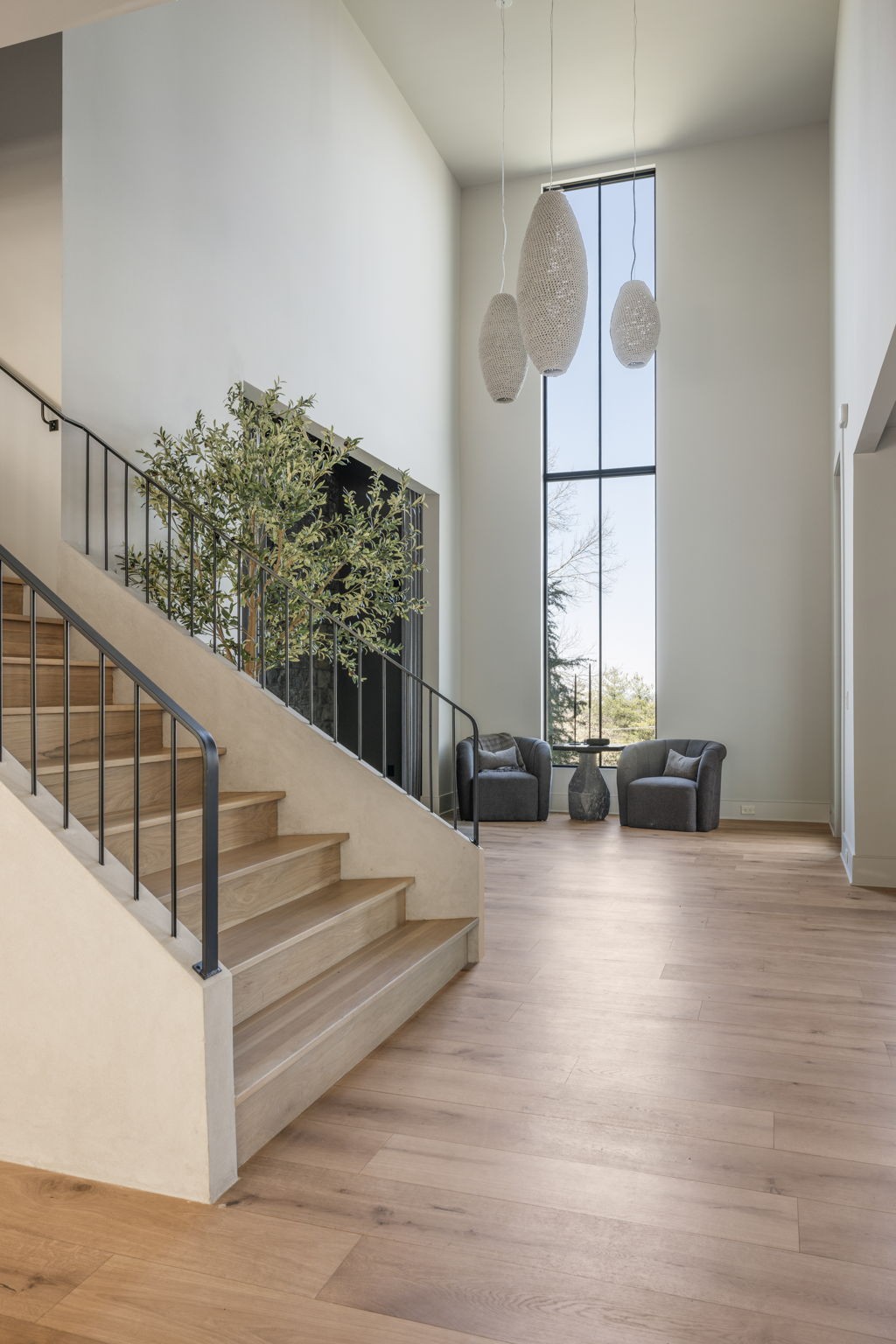 1049 Overton Lea Road Nashville, TN 37220 - Photo 5 of 53 a view of staircase with white walls and windows