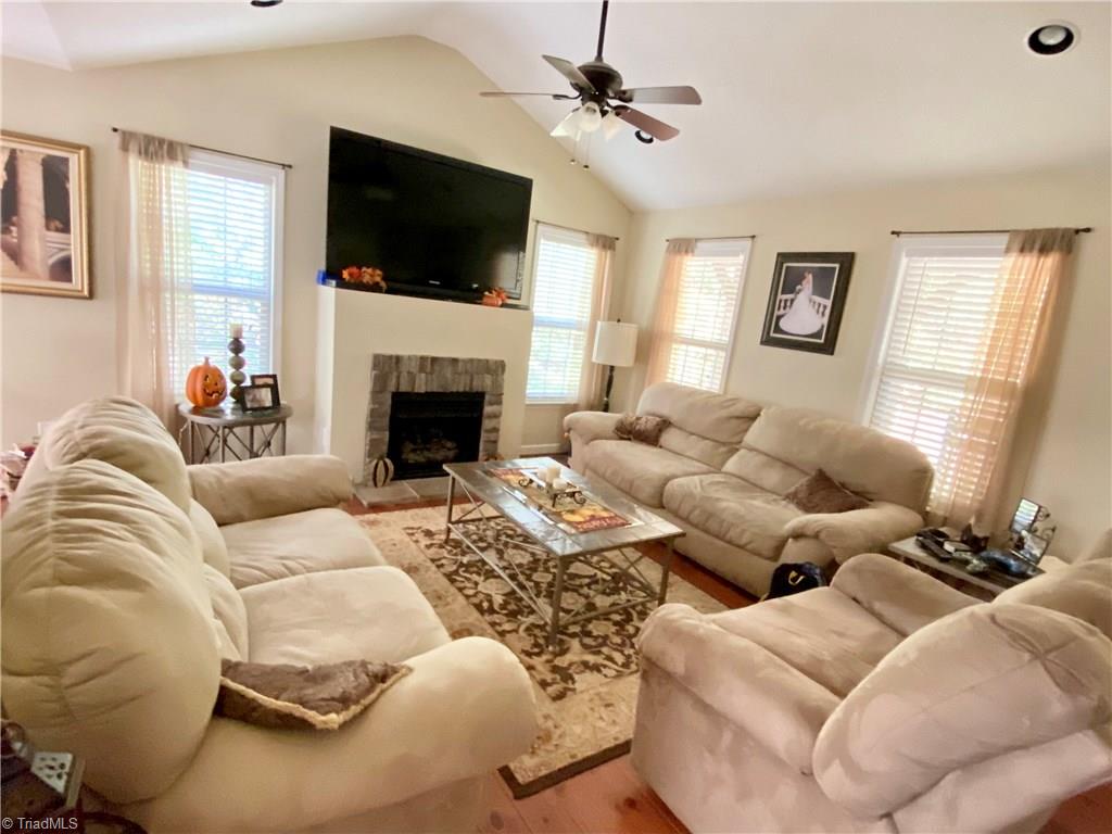 268 Old Mountain Road Lexington, NC 27292 - Photo 8 of 26 Family Room featuring hardwoods, gas logs, & a valued ceiling