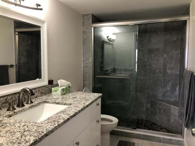 1631 Riverview Road, Unit 606 Deerfield Beach, FL 33441 - Photo 19 of 38 Main bath w/ walkin shower