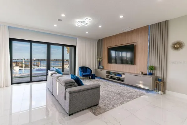 a spacious bedroom with a bed and a dresser in it
