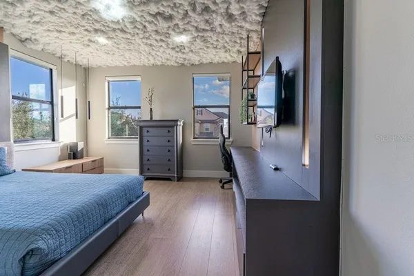 a bedroom with a bed and a table