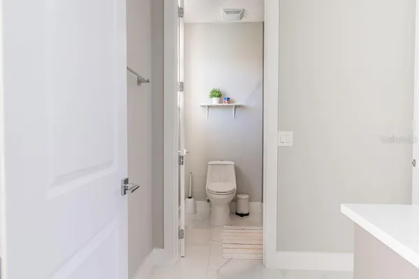 a view of a house with swimming pool and sitting area
