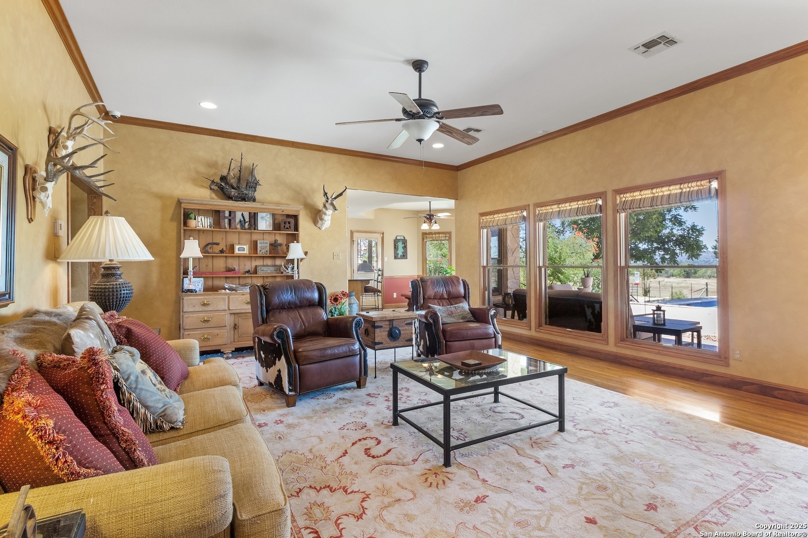 647 Funf Kinder Road Fredericksburg, TX 78624 - Photo 34 of 100 a living room with furniture and a wooden floor
