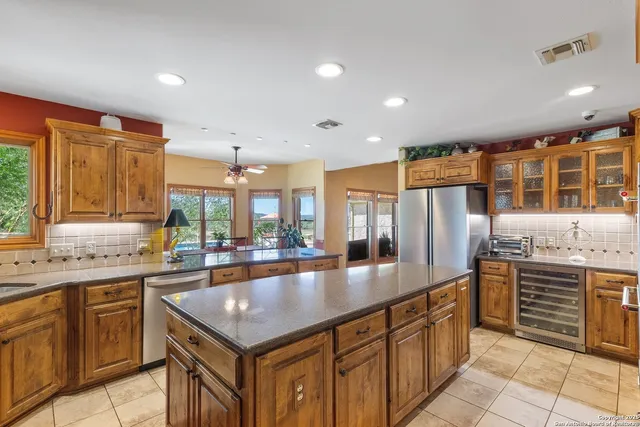 a living room with furniture and kitchen view
