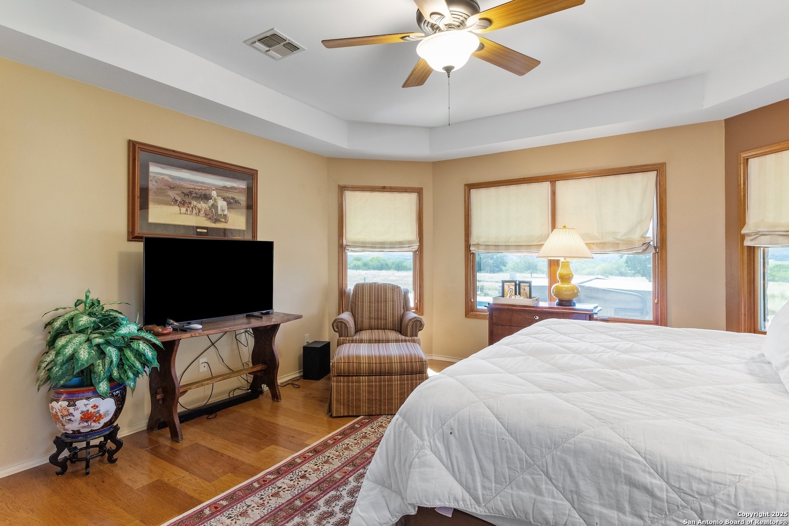 647 Funf Kinder Road Fredericksburg, TX 78624 - Photo 55 of 100 a bedroom with a bed and a flat screen tv