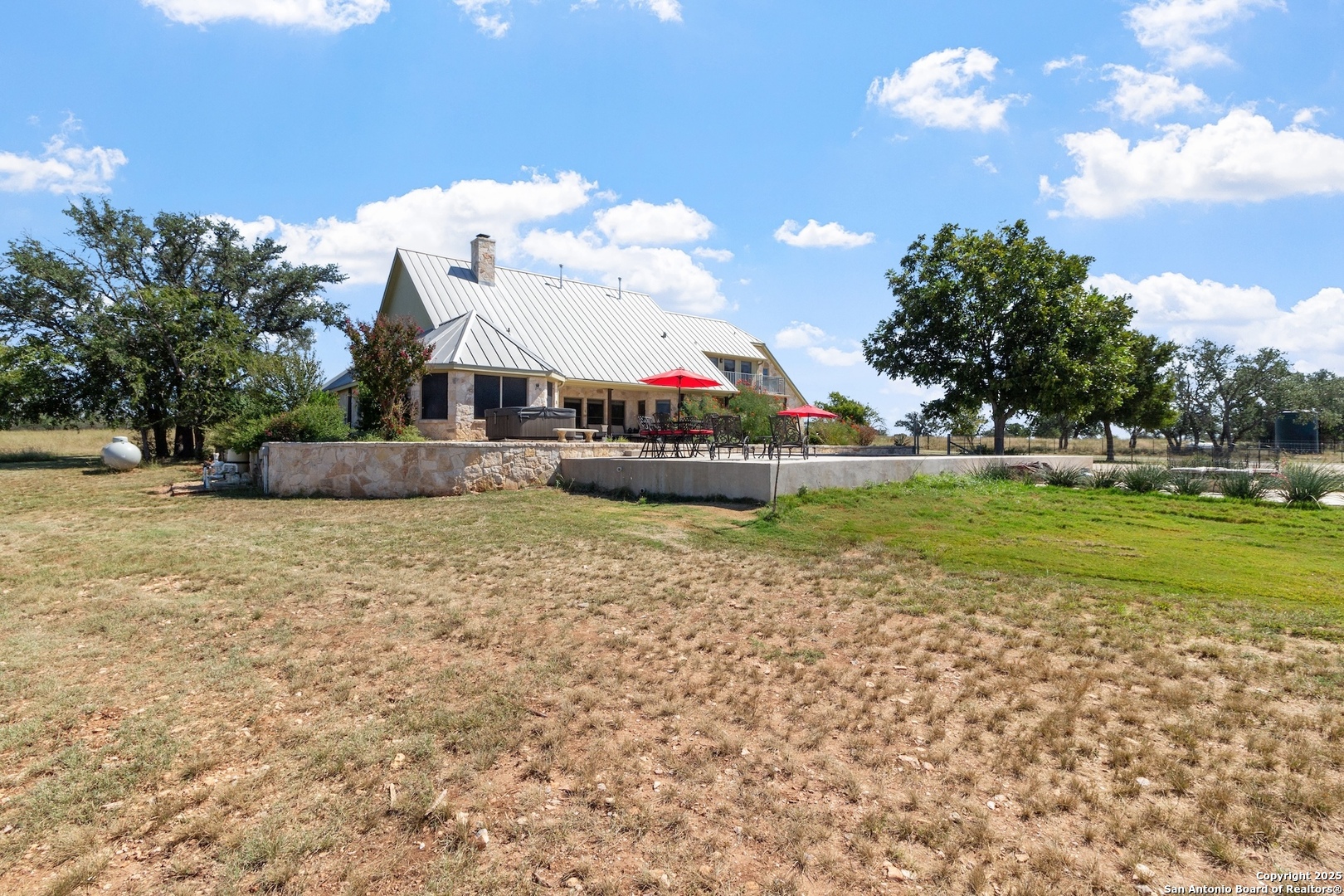 647 Funf Kinder Road Fredericksburg, TX 78624 - Photo 69 of 100 a view of a house with a big yard