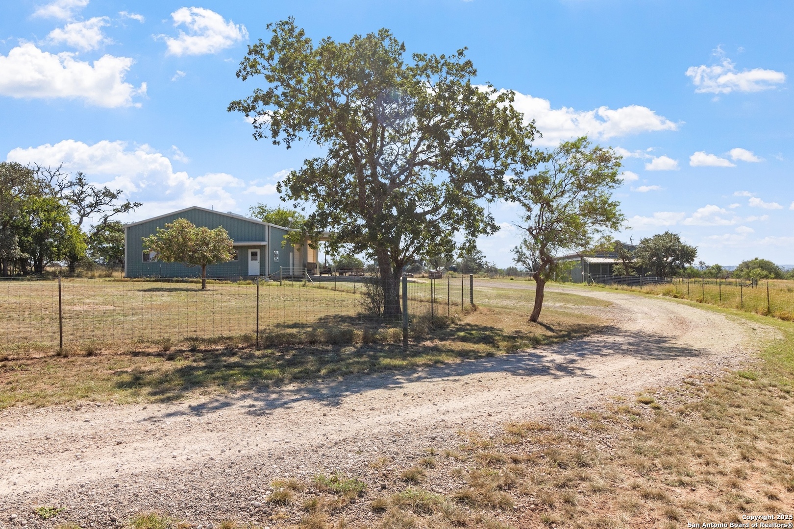 647 Funf Kinder Road Fredericksburg, TX 78624 - Photo 73 of 100 a view of a house with a yard