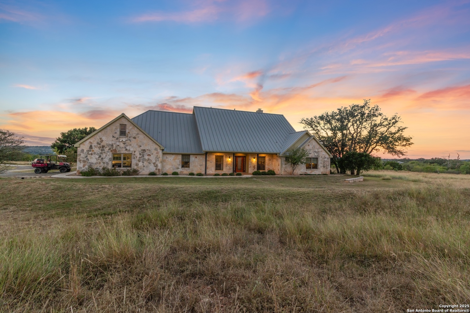 647 Funf Kinder Road Fredericksburg, TX 78624 - Photo 8 of 100 a view of a house with a yard