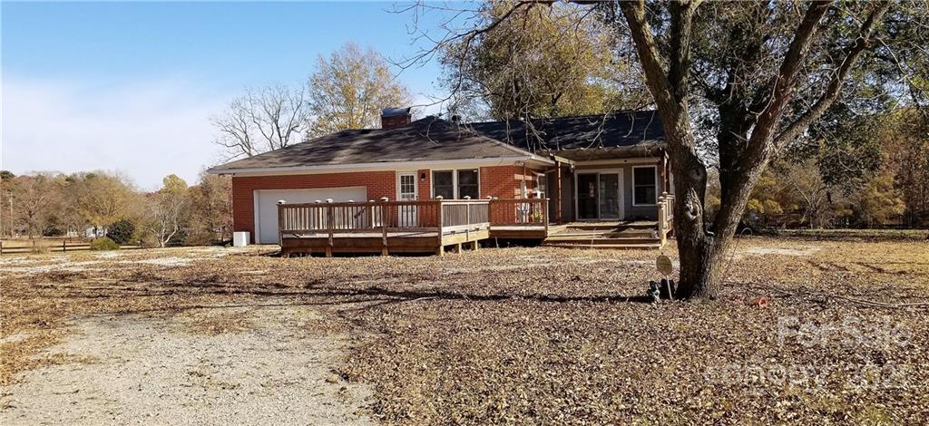 6901 Medlin Road Monroe, NC 28112 - Photo 22 of 23 a front view of a house with a yard