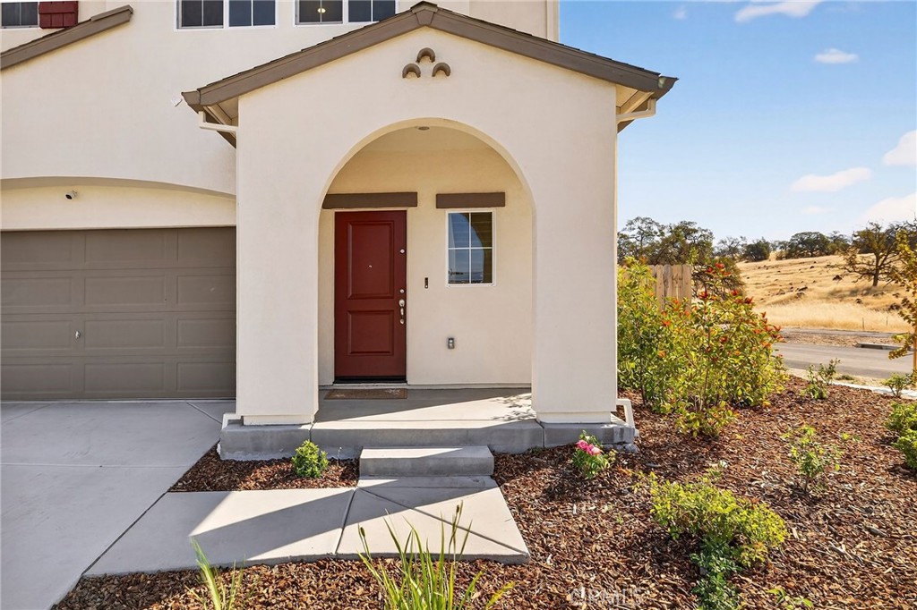1147 Lentil Way Chico, CA 95928 - Photo 14 of 72 a front view of a house with garden