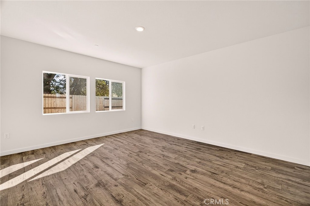 1147 Lentil Way Chico, CA 95928 - Photo 20 of 72 a view of empty room with wooden floor and fan
