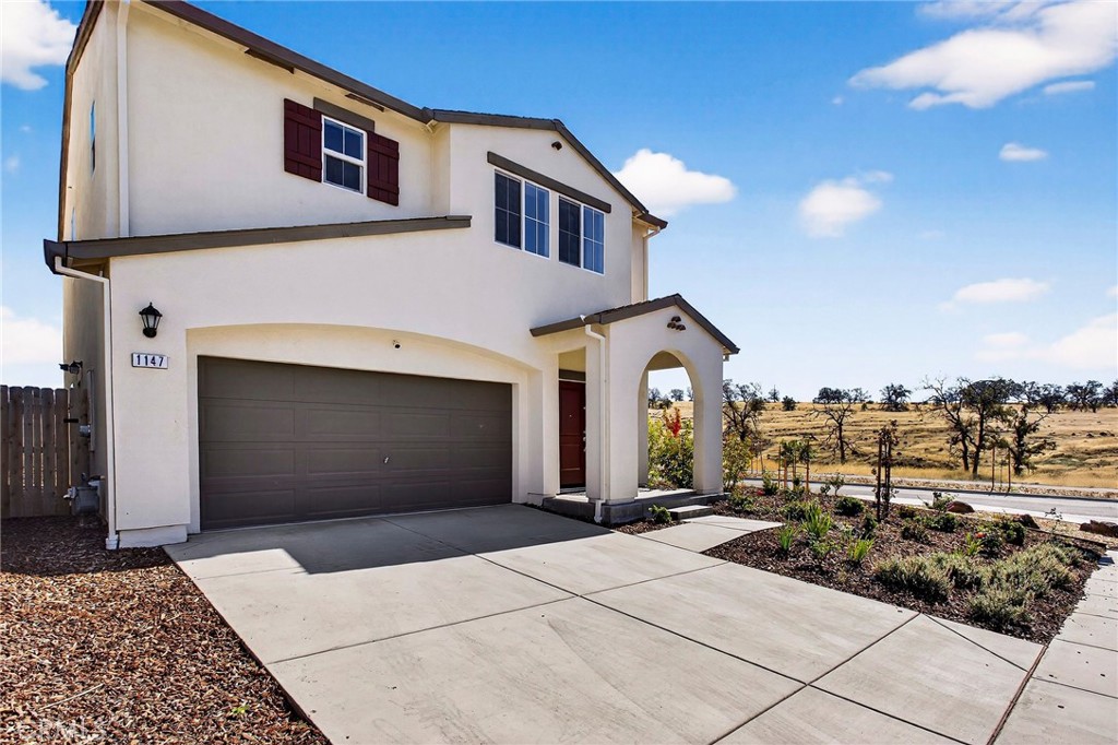 1147 Lentil Way Chico, CA 95928 - Photo 2 of 72 a front view of a house with yard