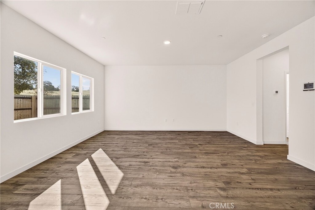 1147 Lentil Way Chico, CA 95928 - Photo 21 of 72 a view of empty room with wooden floor and fan