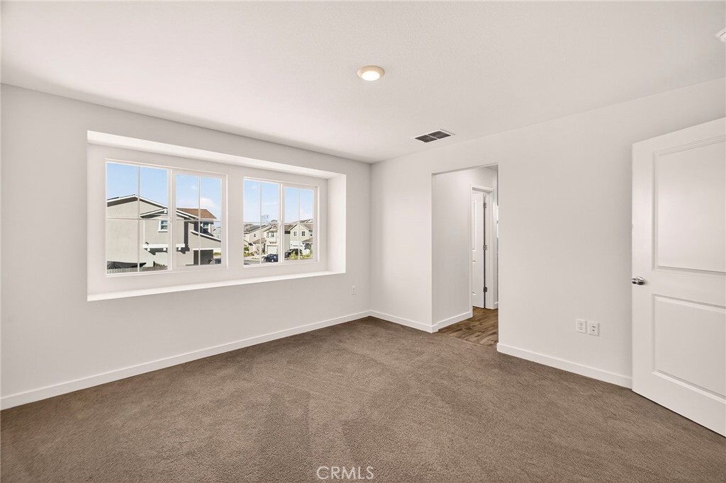 1147 Lentil Way Chico, CA 95928 - Photo 35 of 72 a view of an empty room with window and refrigerator