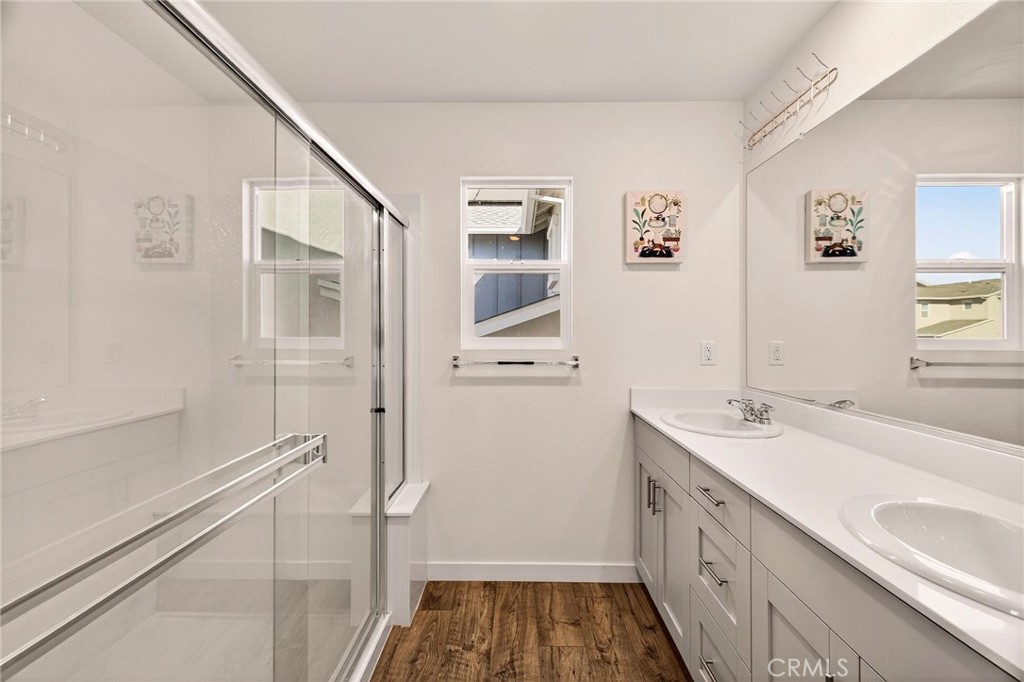 1147 Lentil Way Chico, CA 95928 - Photo 38 of 72 a bathroom with a sink a mirror and a shower
