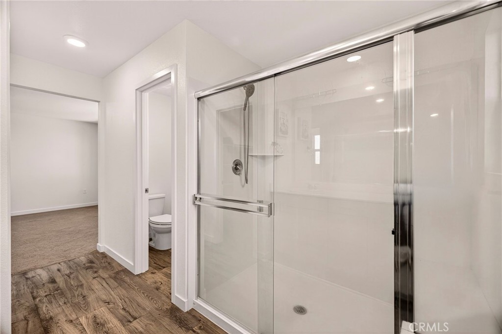 1147 Lentil Way Chico, CA 95928 - Photo 40 of 72 a bathroom with a glass shower door and a bathtub