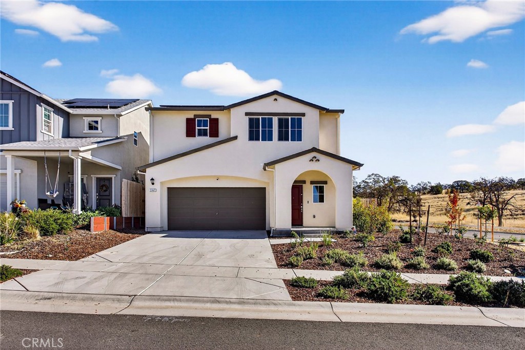 1147 Lentil Way Chico, CA 95928 - Photo 4 of 72 a front view of a house with a yard and garage