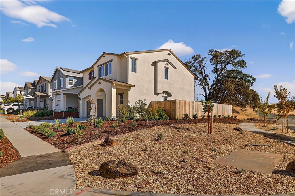 1147 Lentil Way Chico, CA 95928 - Photo 10 of 72 a view of a white house with a yard in front of it