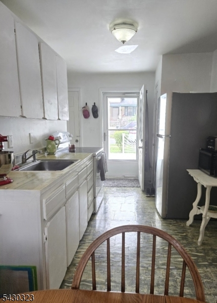 83 Allen Street, Unit 1 Netcong, NJ 07857 - Photo 7 of 16 a kitchen that has a cabinets and a table in it
