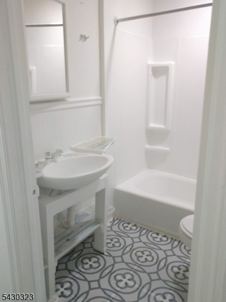 83 Allen Street, Unit 1 Netcong, NJ 07857 - Photo 8 of 16 a bathroom with a sink and a bathtub