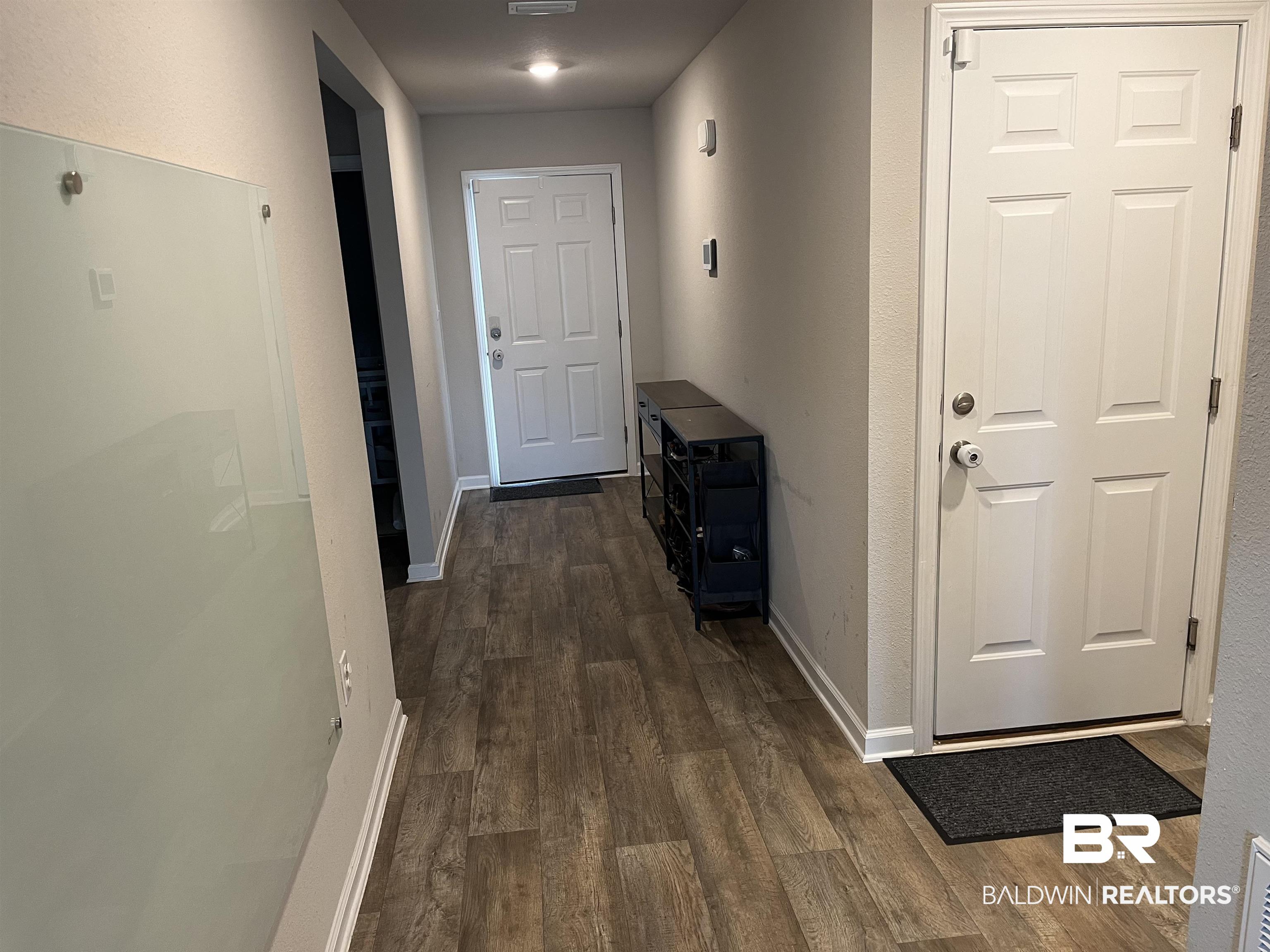 7952 Irwin Loop Daphne, AL 36526 - Photo 16 of 22 Hallway featuring dark hardwood / wood-style flooring