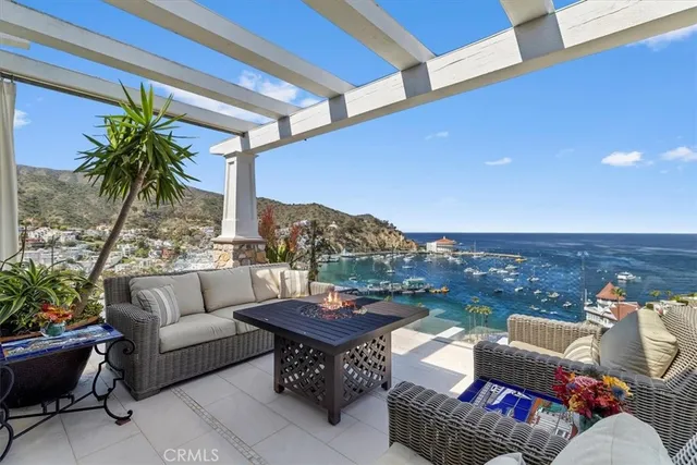 a outdoor living space with furniture and a potted plant