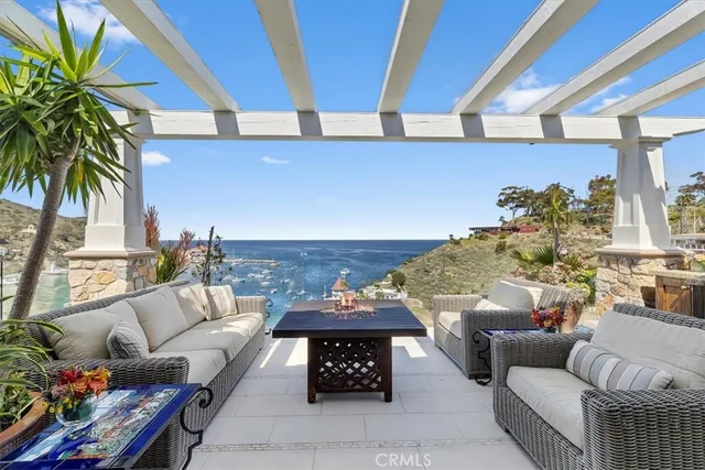 a outdoor living space with furniture and a fireplace