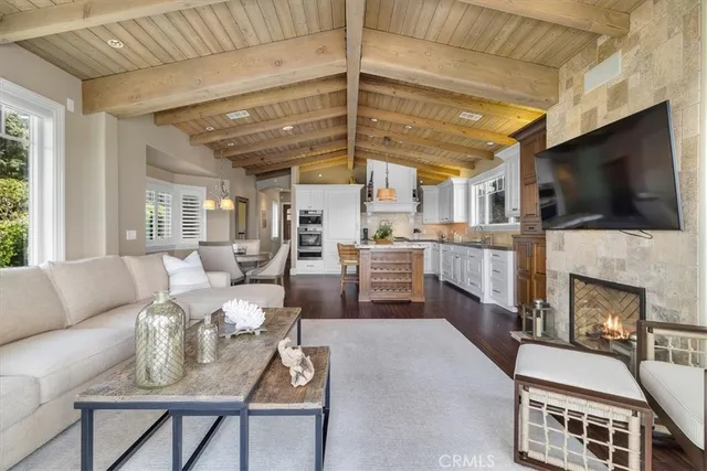 a bathroom with a granite countertop tub and a large window