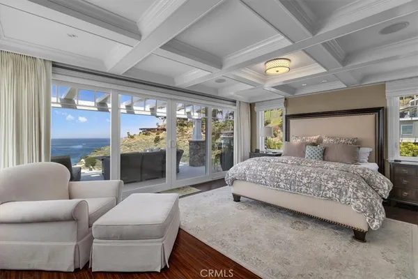 a bedroom with a large bed and a couch