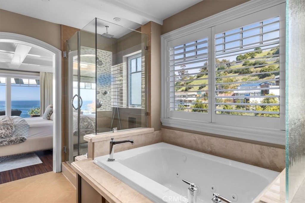 133 Upper Terrace Road Avalon, CA 90704 - Photo 23 of 72 a bathroom with a granite countertop tub and a large window
