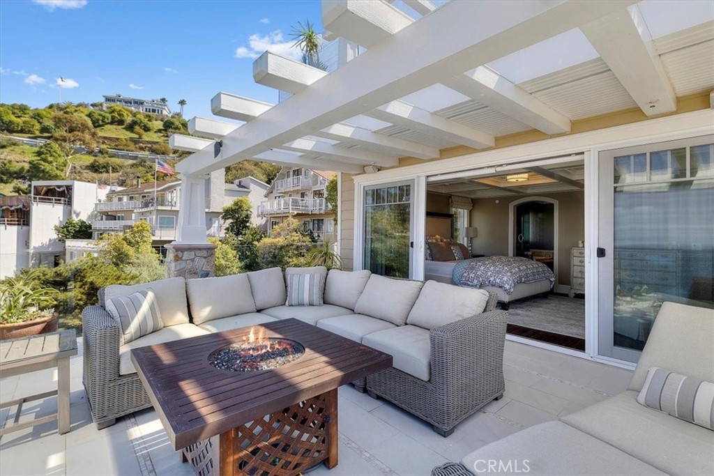 133 Upper Terrace Road Avalon, CA 90704 - Photo 29 of 72 a living room with furniture and a chandelier