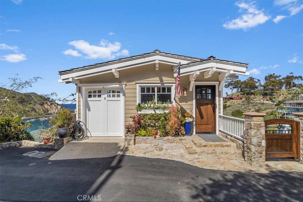 133 Upper Terrace Road Avalon, CA 90704 - Photo 3 of 72 a front view of a house with a yard