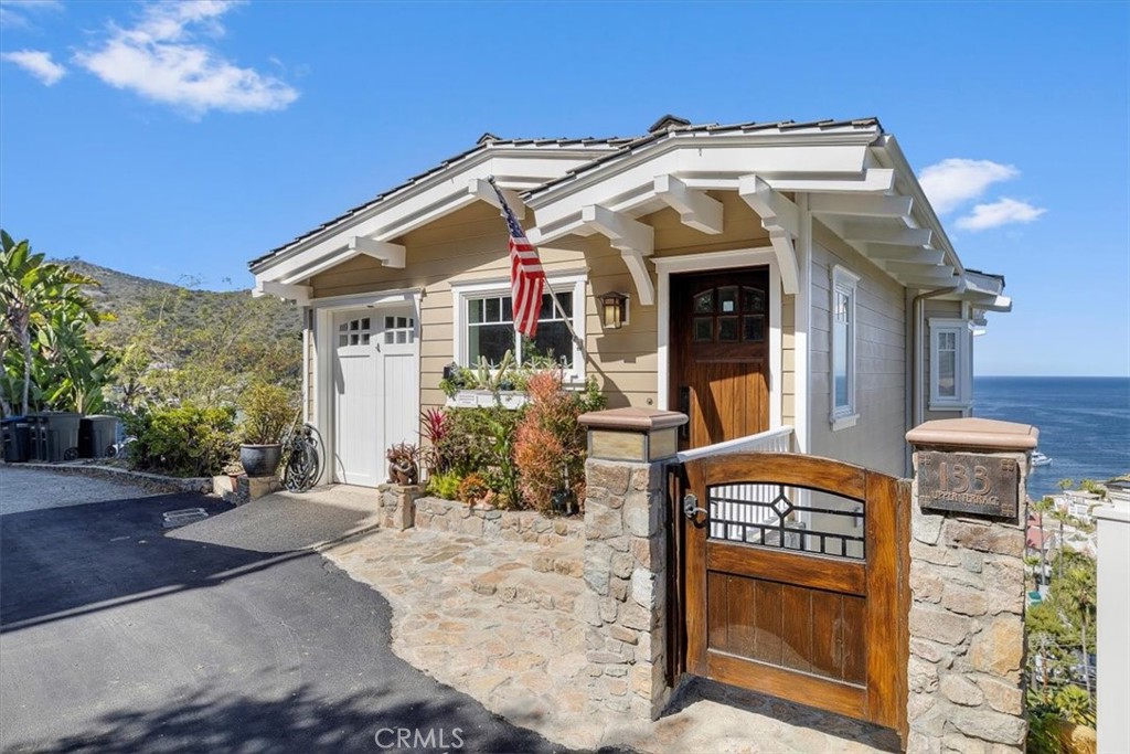 133 Upper Terrace Road Avalon, CA 90704 - Photo 36 of 72 a front view of a house with a yard