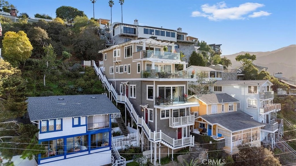 133 Upper Terrace Road Avalon, CA 90704 - Photo 5 of 72 a view of a white building among the street with palm trees