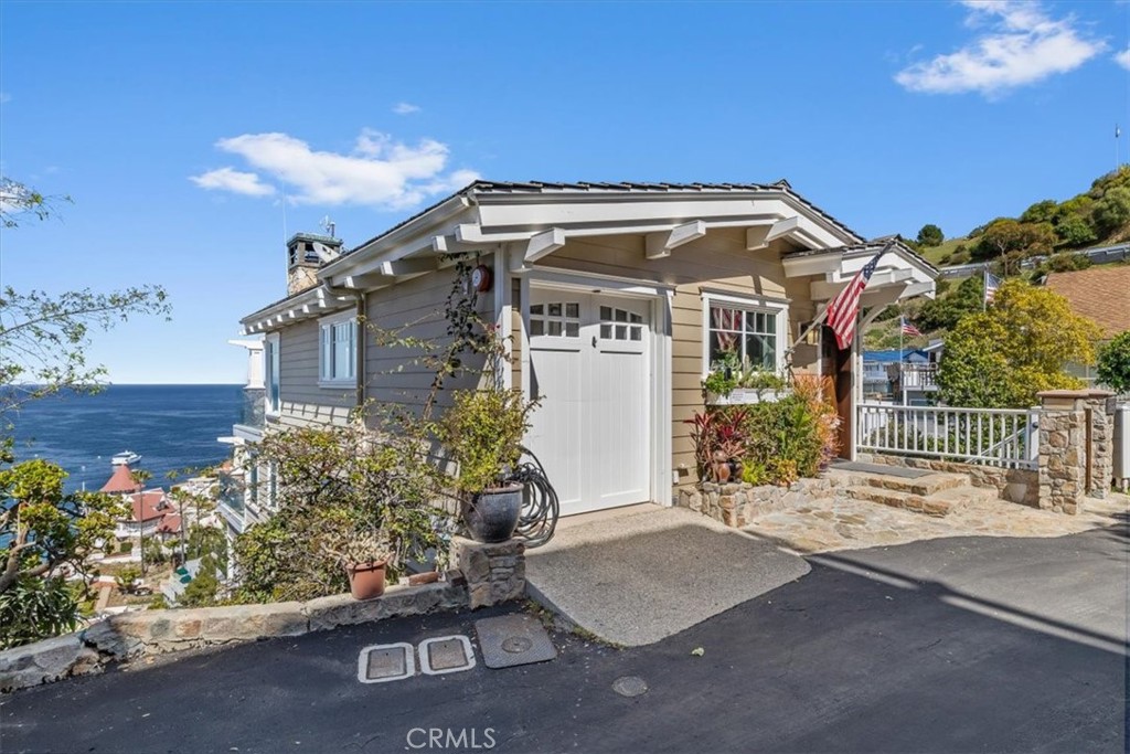 133 Upper Terrace Road Avalon, CA 90704 - Photo 53 of 72 a front view of a house with a yard