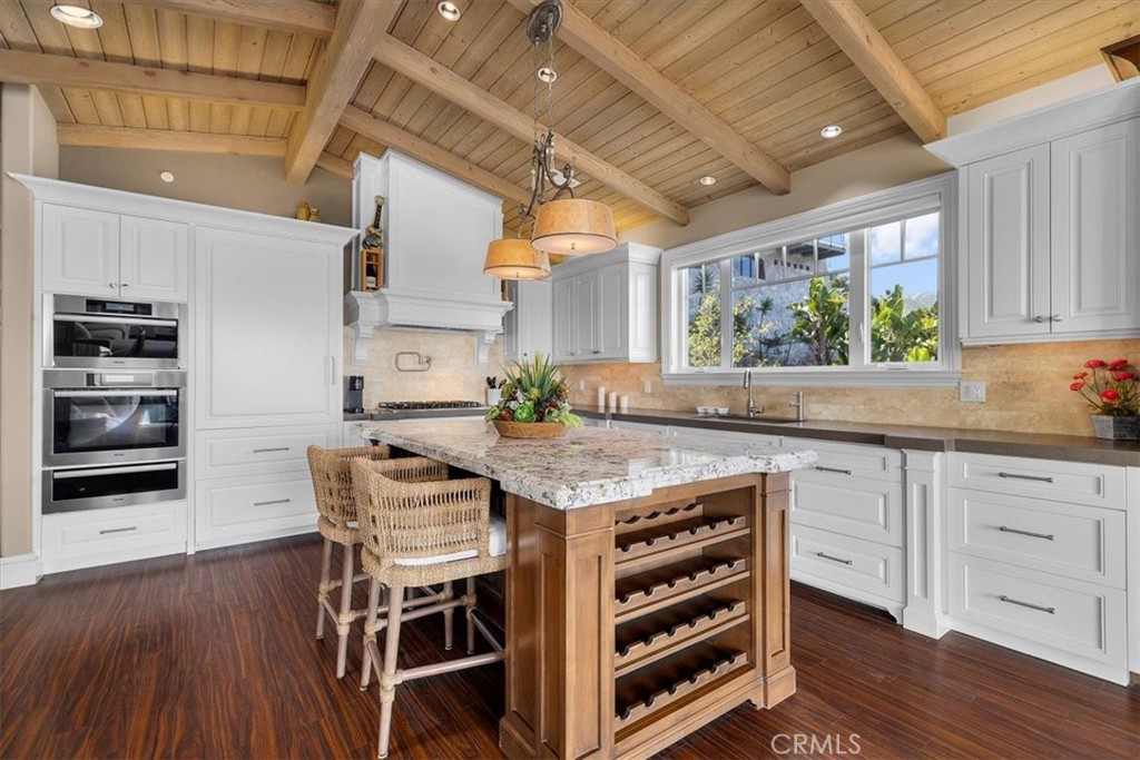 133 Upper Terrace Road Avalon, CA 90704 - Photo 10 of 72 a open kitchen with stainless steel appliances granite countertop a stove and a refrigerator