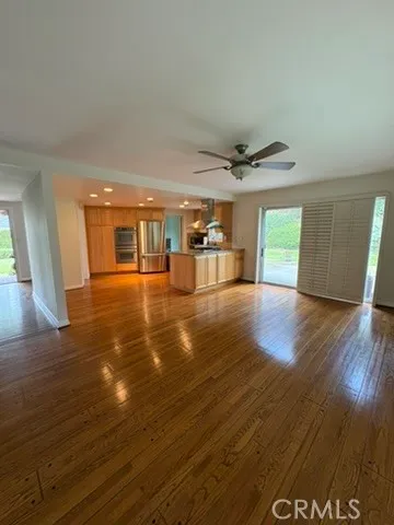 a view of a livingroom with wooden floor