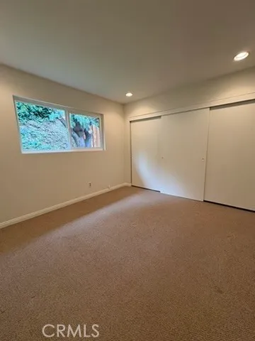 an empty room with an empty space and a window