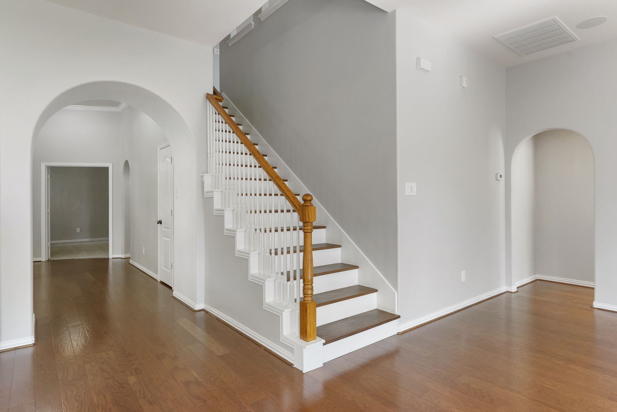 27515 Chris Ridge Court Spring, TX 77386 - Photo 23 of 31 Just off the living room are the stairs that lead up to the large game room.