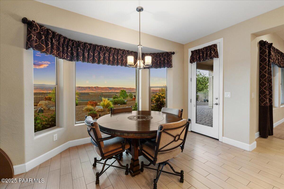 1149 Stack Rock Road Prescott Valley, AZ 86314 - Photo 18 of 85 a dining room with furniture window wooden floor