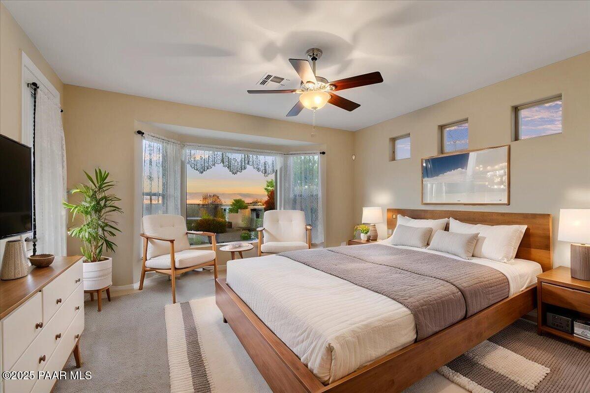 1149 Stack Rock Road Prescott Valley, AZ 86314 - Photo 21 of 85 a bedroom with a bed and a large window